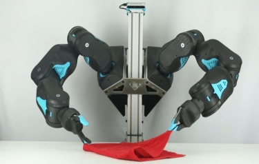 Blue the robot's arms - about the size of a human bodybuilder's -- were designed to take advantage of recent advances in artificial intelligence to master intricate, human-centered tasks, like folding towels. (Credit: Philip Downey)