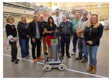 Neutron-detector robot with developers and members of the PPPL Health Physics team. (Photo byElle Starkman, Princeton Plasma Physics Laboratory)