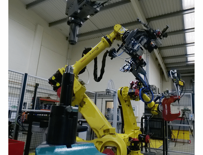 The two robots in cell 1, work in harmony feeding the respective fastening and riveting stations The two robots in cell 1, work in harmony feeding the respective fastening and riveting stations