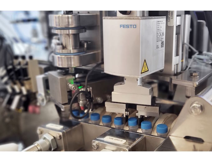 Cap fitting process picks and applies each cap to a specific torque using the Festo EHMD Cap fitting process picks and applies each cap to a specific torque using the Festo EHMD
